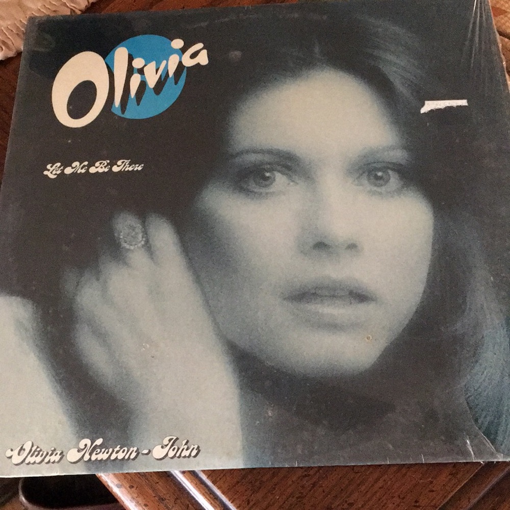 Vintage vinyl album by Olivia “Let Me Be There”. Great album for the collector.